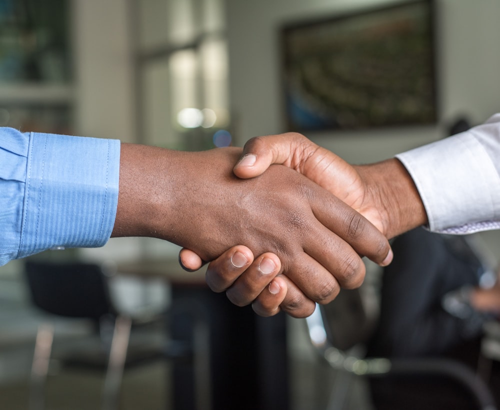 A sponsor partnership handshake